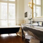 Completed bathroom renovation showing new flooring and vanity in Powell.