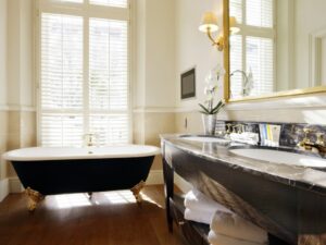 Completed bathroom renovation showing new flooring and vanity in Powell.