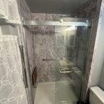 Waterproof luxury vinyl plank flooring installation in a renovated bathroom in Dublin.