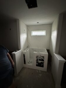 Barrier-free walk-in shower with wide entry for wheelchair accessibility in Columbus.