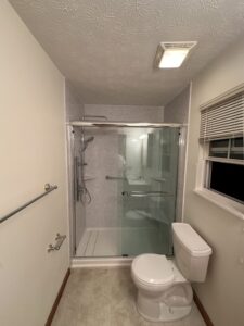Low-barrier walk-in shower installation with textured tile flooring in Columbus, OH.