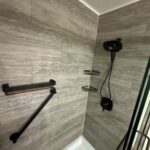 Maintenance-free acrylic bathtub replacement with modern wall surround in Dublin.