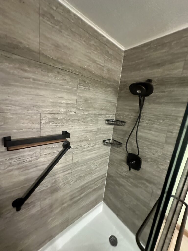 Maintenance-free acrylic bathtub replacement with modern wall surround in Dublin.