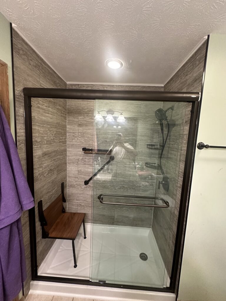 High-polish chrome shower fixtures and adjustable shower head in Powell, Ohio.