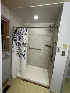 Luxury walk-in shower featuring dual shower heads and custom tiling in Dublin, OH.