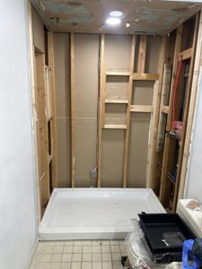 Dual shower head system with adjustable handheld wand in Dublin, OH.