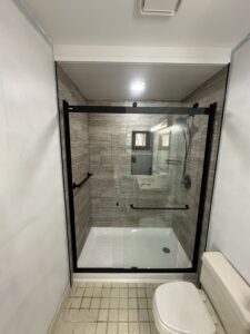 Seamless transition between new bathroom tile flooring and hallway in Dublin, OH.