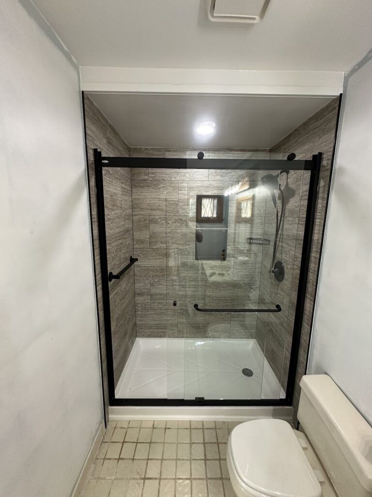 Seamless transition between new bathroom tile flooring and hallway in Dublin, OH.