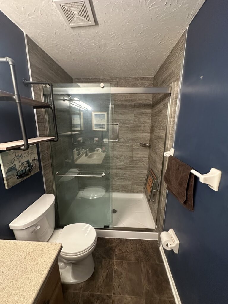 Brushed nickel high-pressure shower head installation in Columbus, OH.