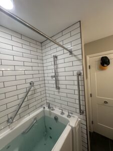 Ergonomic chrome handle for frameless glass shower door in Dublin, OH.