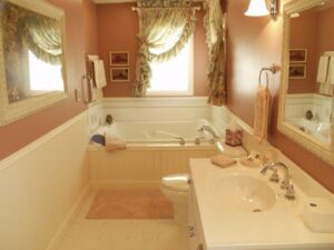 Complete traditional bathroom remodel featuring a custom vanity, large soaking tub, and elegant wall decor in Columbus, OH.
