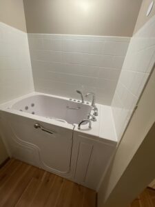 Completed bathroom renovation with new vanity, lighting, and flooring in Columbus.