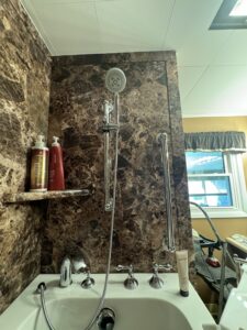 Detachable handheld shower wand with adjustable slide bar in Powell, Ohio.