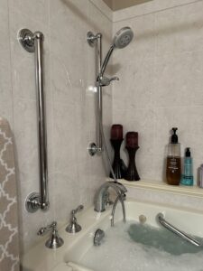 Luxury chrome shower head and safety grab bar installation in Grove City Ohio
