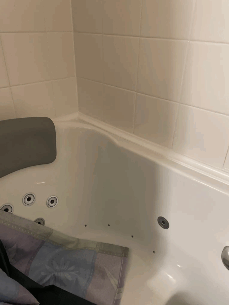 Built-in shower niche with mosaic tile detail and chrome hardware in Dublin, OH.