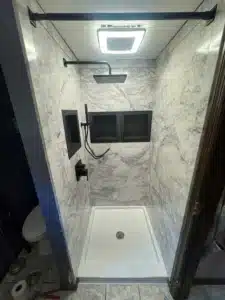 Custom walk-in shower conversion with marble wall surround in Powell Ohio