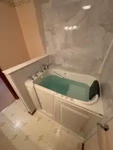Decorative patterned floor tiles in a newly renovated walk-in shower in Powell.