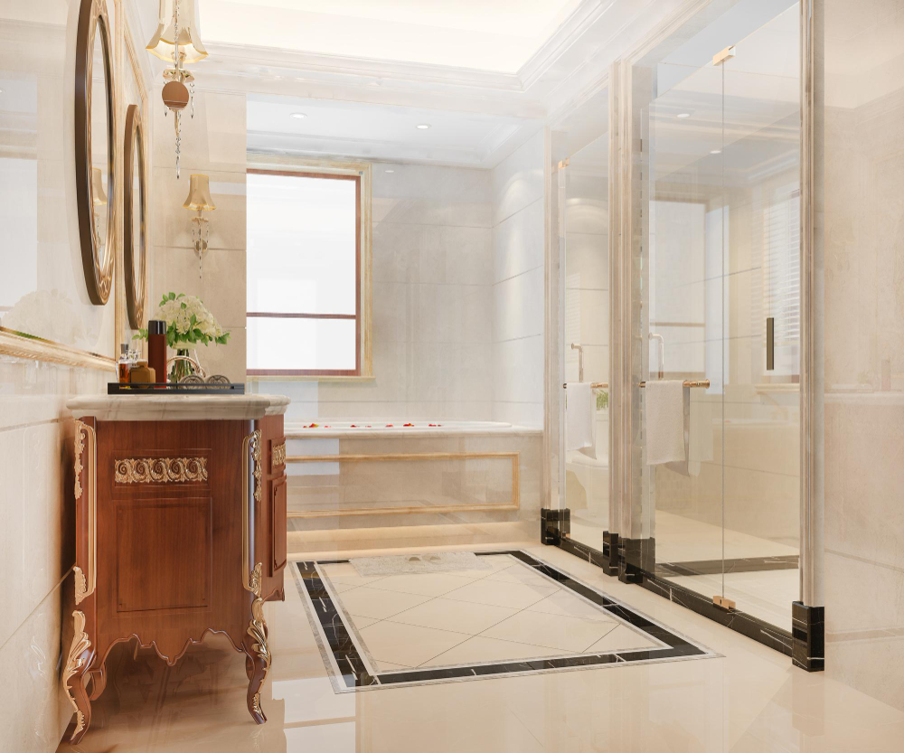Luxury Bathroom With Ornate Wood Vanity, Glass Shower Enclosure, Soaking Tub, Round Mirrors, And Cream Marble Tile Floors
