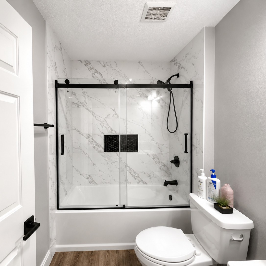 After: Marble-Look Tub And Shower With Black-Framed Sliding Glass Door In Powell, Oh Bathroom Remodel