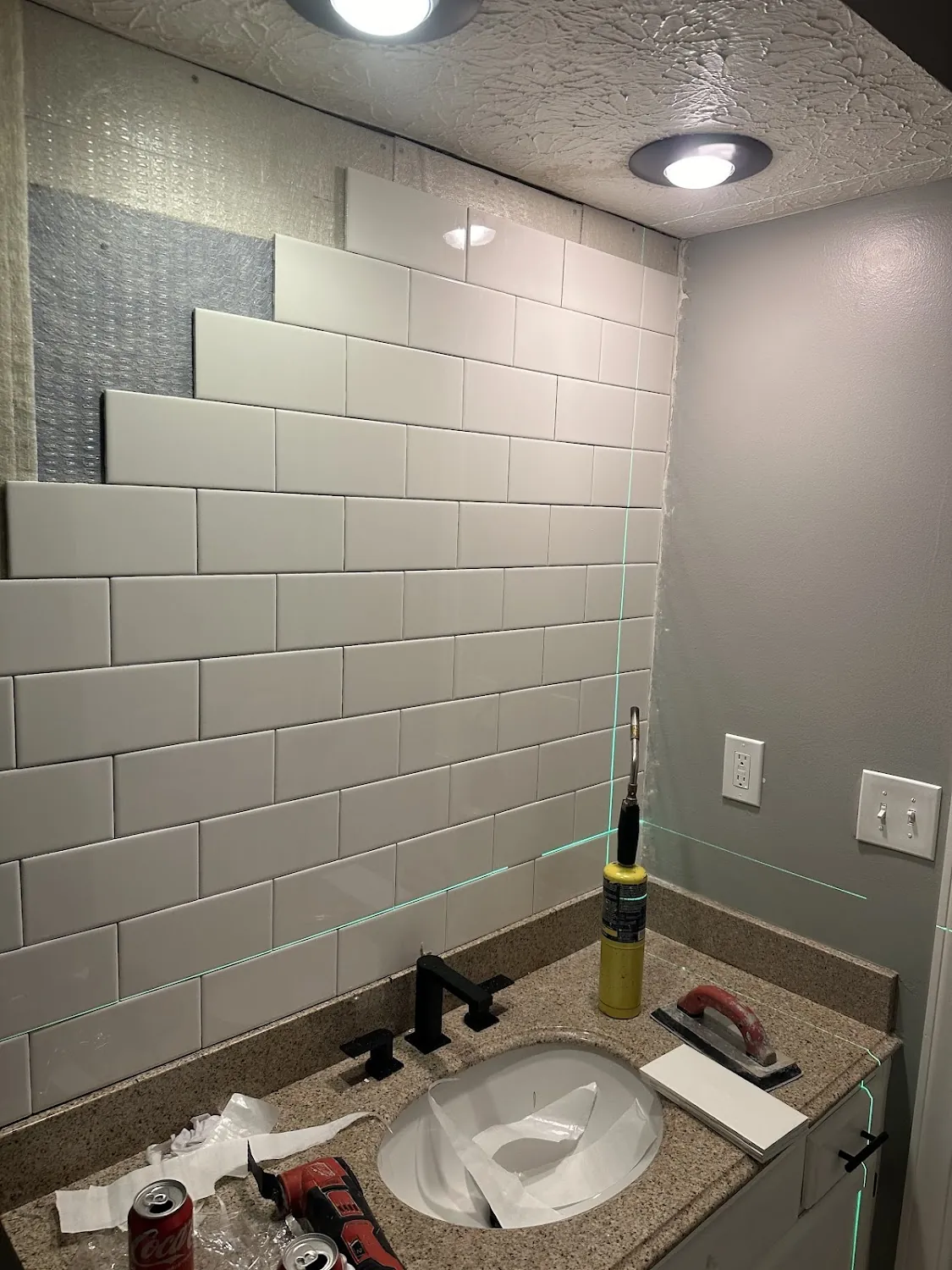 Custom white subway tile backsplash and vanity installation in Dublin Ohio