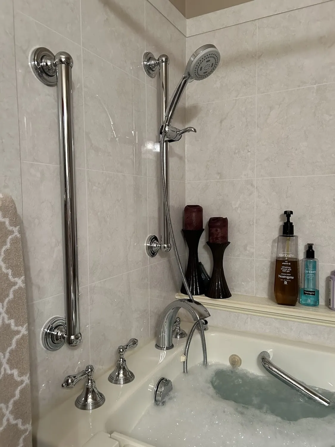 Luxury chrome shower head and safety grab bar installation in Grove City Ohio